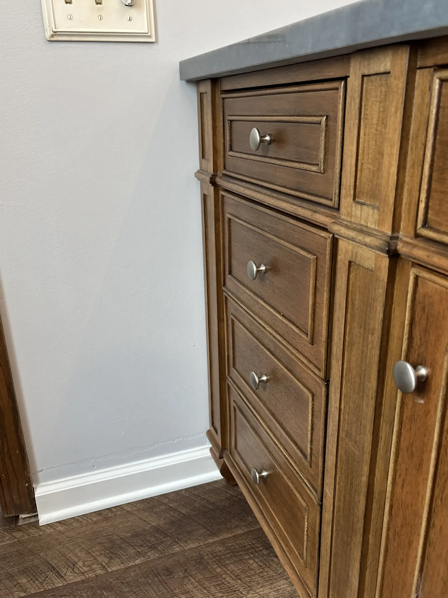 Wood vanity with satin hardware